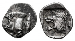 Mysia. Kyzikos. Obol. 450-400 BC. (Sng France-361). Anv.: Forepart of boar left, tunny upward to right. Rev.: Head of roaring lion left within incuse ...