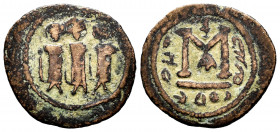 Jun of Jordan. Fals. 660-680 AD. (Album-3512). (Goodwin-29). Anv.: Three robed and crowned figures standing facing, each holding staff. Rev.: Large M,...