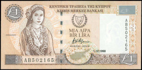 GREECE: 1 Pound (1.12.1998) in brown on light tan and multicolor unpt with Cypriot girl at left and Arms at upper center. S/N: "AB 502165". WMK: Bust ...