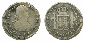 AMÉRICA. Fernando VII (1808-1833). 1817 FJ. 1 real. Santiago (AC 679). 3,25 g. AR. Multiples rayitas
bc