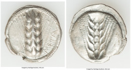 LUCANIA. Metapontum. Ca. 510-470 BC. AR stater (25.mm, 7.00 gm, 12h). VF, edge chip. META, seven-grained barley ear; guilloche border on raised rim / ...