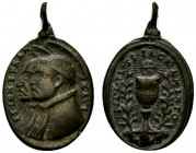 Medaglia (mm. 25x15). Busti dei SS. Ignazio e Francesco Saverio a sn. R/ Calice con ostia raggiante tra rami. AE - +BB