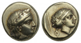 Greek
Lesbos, Mytilene EL Hecte. Circa 377-326 BC. 2.49gr. 10.8mm.
Laureate head of Apollo right; small coiled serpent behind / Head of female right, ...