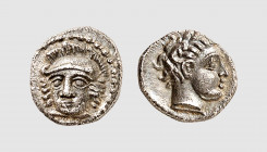 Cilicia. Issus (?). 4th century BC. AR Obol (0.81g, 3h). Apparently unique. Old cabinet tone. A charming coin. Choice extremely fine. From a private c...