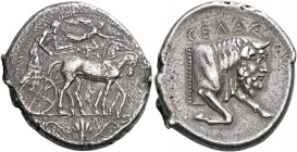 SICILY. Gela. Circa 450-440 BC. Tetradrachm (Silver, 28 mm, 16.51 g, 8 h). Quadriga driven slowly to right by a bearded charioteer; above, Nike flying...