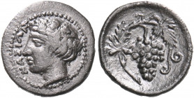 SICILY. Naxos. Circa 415-403 BC. Litra (Silver, 12.5 mm, 0.64 g, 3 h). ΝΑΞΙΩΝ Head of youthful Dionysos to left, wearing ivy wreath. Rev. Vine branch ...