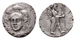 CILICIA. Uncertain. 4th Century BC. Obol. Head of Athena facing slightly left, wearing triple-crested helmet. Rev. King standing right, holding scepte...