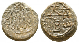 Byzantine lead seal of N. comes of the cortes of the agelai
(8th cent.)

Obverse: Cruciform invocative monogram inscribed in the corners, +ΘΕΟΤΟΚΕ ...