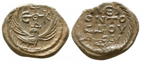 Byzantine lead seal of Leon officer
(7th cent.)

Obverse: Eagle with raised open wings to left, cruciform invocative monogram over its head, ΘΕΟΤΟΚ...