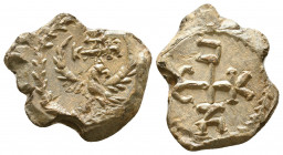 Byzantine lead seal of N. officer
(7th cent.)

Obverse: Eagle with open raised wings to right, cruciform invocative monogram over its head, ΘΕΟΤΟΚΕ...