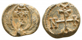 Byzantine lead seal of N. officer
(7th cent.)
Obverse: Eagle with open raised wings to right, cruciform invocative monogram over its head, ΘΕΟΤΟΚΕ Β...