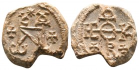 Byzantine lead seal of Constantinos patrikios
(6th cent.)

Obverse: Cruciform invocative monogram with crosses in the lower corners, ΘΕΟΤΟΚΕ ΒΟΗΘEI...