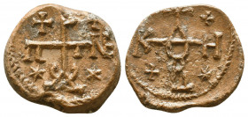 Byzantine lead seal of N. officer
(7th cent.)

Obverse: Cruciform invocative monogram with stars and crosses in the corners, ΘΕΟΤΟΚΕ ΒΟΗΘEI = Θεοτό...