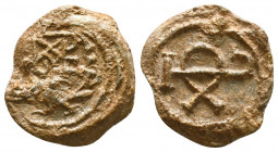 Byzantine lead seal of Theodosios eparchos (or honorary eparch)
(7th cent.)

Obverse: Invocative block monogram, resolved possibly as  ΘΕΟΔΟCΙΟΥ  =...