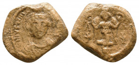 Imperial lead seal of Justinian I
(527-565)

Obverse: DN IVSTINI-[ANVS PP AV], draped bust of the emperor with halo, wearing crown with pendant and...
