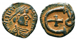 Byzantine Coins, 7th - 13th Centuries
Justinian I. A.D. 527-565. AE 
Condition: Very Fine

Weight: 1.9 gr
Diameter: 14 mm