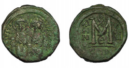 IMPERIO BIZANTINO. JUSTINO II. Follis. Constantinopla (565-566). A/ Justino y Sofía entronizados y nimbados. AE 14,95 g. 31,3 mm. SBB-360. Pátina verd...