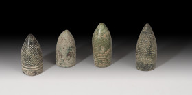 HISPANO ÁRABE. Califato o Reyes de Taifas. Lote cuatro dedales de guarnicero (X-XI d.C.). Bronce. Altura 4,1-5,2 cm.