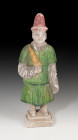 CHINA. Figura de músico. (Dinastía Ming, 1500-1600 d.C.). Terracota policromada y vidriada. Altura 25,8 cm.