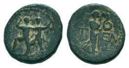 PISIDIA. Etenna.1st Century BC.AE Bronze.Two men standing side by side; the left brandishing double-axe, the right sickle / ET - EN, Nymph advancing r...