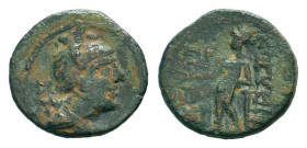 CILICIA.Soloi.Circa 1st Century BC.AE Bronze.Helmeted head of Athena right / ΣΟΛΕΩΝ. Dionysos standing facing, holding thyrsos and pouring kantharos; ...