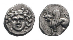 CILICIA.Uncertain. 4th century BC. AR Obol. Gorgoneion facing, wearing triple-pendant earrings / Sphinx seated left. SNG France 479; SNG Levante 250; ...