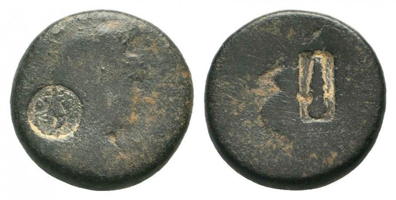UNCERTAIN.AE Bronze. Head od men to righy, Countermark / Blank worn surface, Cou...