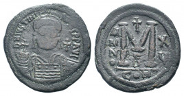 JUSTINIAN I.527-565 AD. Constantinople mint.AE Follis.DN IVSTINIANVS PP AVG, helmeted, cuirassed bust facing holding cross on globe and shield; cross ...