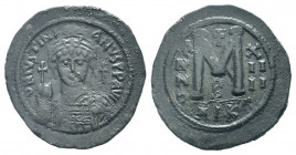 JUSTINIAN I.527-565 AD.Nicomedia mint.AE Follis. DN IVSTINIANVS PP AVG, helmeted, cuirassed bust facing, holding cross on globe and shield with horsem...