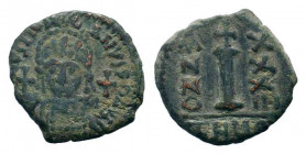 JUSTINIAN I.527-565 AD.Antioch mint.AE Decanummium. DN IVSTINIANVS PP AVG, helmeted, cuirassed bust facing, holding cross on globe and long sceptre, c...