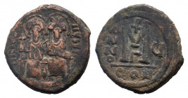 JUSTIN II and SOPHIA.565-578 AD.Constantinople mint.AE Follis. DN IVSTINVS PP AVG, Justin on left holding cross on globe and Sophia on right, holding ...