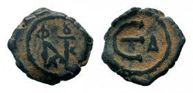 JUSTIN II.565-578 AD. Constantinople mint. AE decanummium.Monogram / Large epsilon, officina letter to right. No mintmark. Sear 363; DOC 60.Good fine....