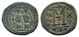JUSTIN II and SOPHIA.565-578 AD.Nicomedia mint.AE Follis. D N IVSTINVS P P AVG, Justin II on left, Sophia on right, seated facing on double-throne, bo...