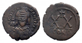 TIBERIUS II CONSTANTINE.578-582 AD. Constantinople mint.AE Half Follis. DM TIB CONTANT PP AV, crowned and cuirassed bust facing, holding cross on glob...