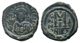 MAURICE TIBERIUS. 582-602 AD.Nicomedia mint.AE Follis.DN MAVRIC TIbER PP A, helmeted and cuirassed or crowned and cuirassed bust facing, holding cross...