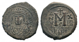 MAURICE TIBERIUS. 582-602 AD. Antioch mint.AE Follis. DN MAVΓI CN P AUT, crowned bust facing, wearing consular robes; holding mappa and eagle-tipped s...