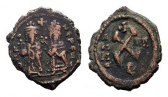 PHOCAS. 602-610 AD.Antioch mint. AE Decanummium.O N FOCA NE PE A, Phocas, holding holding cross on globe, and Leontia, holding a cross-tipped sceptre,...