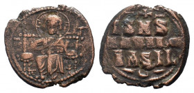 CONSTANTINE IX.1042-1055 AD.Class D Anonymous.AE follis. IC to left, XC to right of Christ, nimbate, seated facing on throne with back, holding book o...