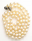 Filo di perle barocche di diametro 9,5/10mm con chiusura a sfera di diametro cm. 1,4 in oro bianco e diamanti huit-huit di complessivi ct. 1,00 c.a (u...