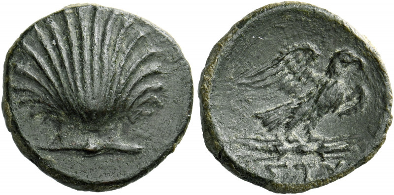 Apulia, Sturni.   Bronze circa 250-210, Æ 2.05 g. Cockle shell. Rev. Eagle stand...