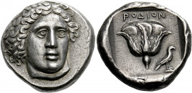 Rhodes.   Tetradrachm circa 404-385, AR 15.42 g. Head of Helios facing three-quarters r. Rev. ΡΟΔΙΟΝ Rose; in lower field r., eagle standing r. with c...