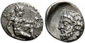 Uncertain mint in Cilicia.   Obol 4th century BC, AR 0.72 g. Heracles kneeling r., holding bow and club, with lion skin tied at neck and draped over l...