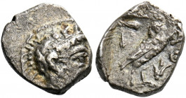 Philistia, Gaza.   Ma‘eh or obol circa 450–400 BC, AR 0.61 g. Helmeted Athena r. Rev. ΑΘ on r. field. Owl r. head facing; in upper l. field olive spra...