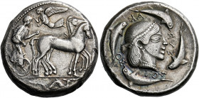 Syracuse.   Tetradrachm of the Demareteion series circa 480-465, AR 17.25 g. Slow quadriga driven r. by charioteer, holding kentron and reins; above, ...
