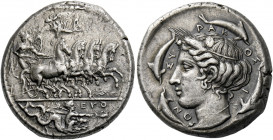 Syracuse.   Tetradrachm signed by Euth... and Phrygillos circa 413-399, AR 17.30 g. Fast quadriga driven r. by winged young god, holding reins with bo...