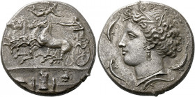 Syracuse.   Decadrachm signed by Euainetos circa 400, AR 42.62 g. Fast quadriga driven l. by charioteer, holding reins and kentron; in field above, Ni...