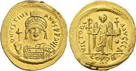 Justinian I, 527 – 565.   Solidus 545-565, AV 4.47 g. D N IVSTINI – ANVS P P AVG Helmeted, pearl-diademed and cuirassed bust three-quarters facing, ho...