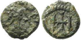 Anonymous Copper issues in Iberia. Toleto.   Bronze mid VII century, Æ 0.77 g. Figure advancing r.: in r. field, cross. Rev. Monogram. Crusafont, grou...
