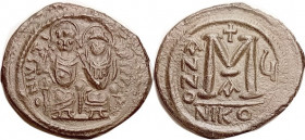 JUSTIN II , Follis, S369, NIKO- u -A, VF+, nrly centered on large oval flan, olive-brown patina, modest roughness mainly in one area at obv rt; the fi...