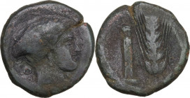 Greek Italy. Southern Lucania, Metapontum. AE Obol, c. 400-350 BC. Obv. Head of Nike right; O behind; below, [NIKA]. Rev. [M]-E. Ear of barley with si...